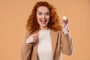 Successful BusinessWoman With Bitcoin, Crypto Currency. Golden Coin On Beige Background. Btc