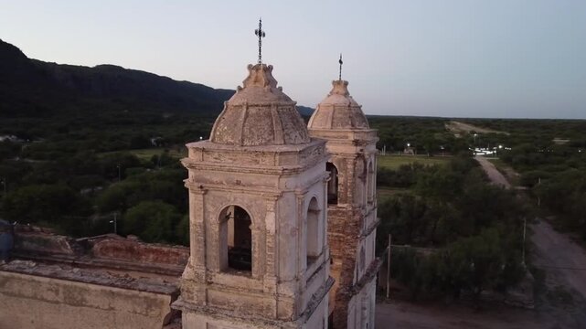 Religious adobe structure split by earthquakes with panoramic views of the high mountains in the town of Ambil La Rioja Argentina.
