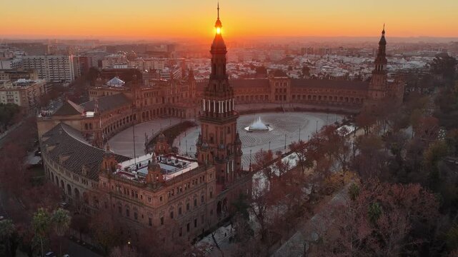 Sunrise drone view of Plaza de Espana, Spanish Square in Seville, Spain. Morning aerial view of Seville city and Plaza de Espana in Maria Luisa Park