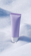 A stylish lavender cream tube placed on soft snow, showcasing beauty and winter skincare in a minimalistic setting.