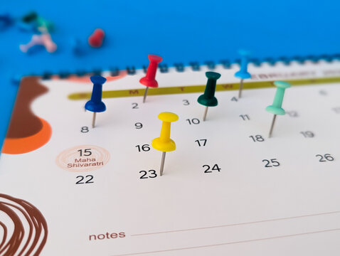 2026 calendar with multiple colorful push pins for appointment scheduling concept