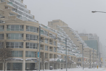 Naklejka premium wide view of Kings Landing designed by Arthur Erickson located at 480 Queens Quay W during a snow storm on 2026-01-15 in Toronto