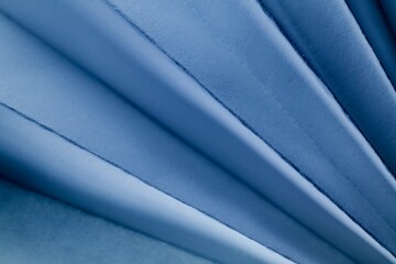 Minimalist design of layers of blue paper.