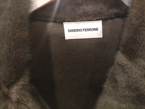Rome, Italy - January 11, 2026: Sandro Ferrone brand label on luxurious fur coat, showcasing high-quality craftsmanship and elegant design, perfect for winter fashion enthusiasts