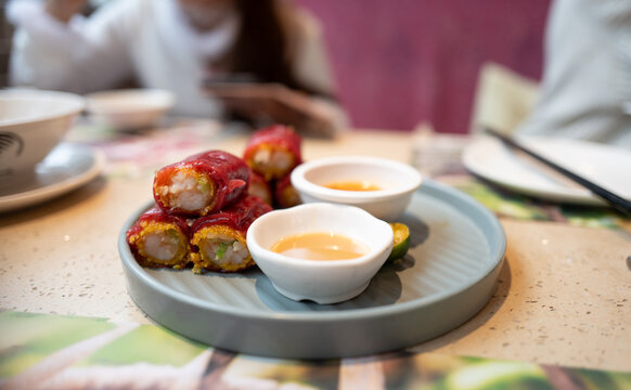 Delicious Red Rice Noodle Rolls Filled with Shrimp and Crispy Net 