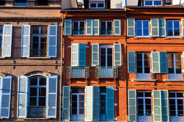 Obraz premium Brick façades facing Place Saint-Etienne illuminated by winter sunlight in central Toulouse