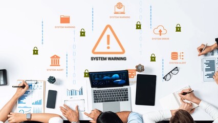 Business professionals analyzing data in a creative workspace with system warning alerts and cybersecurity graphics displayed on the table. Gluon.