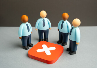Office workers stand over a cancellation sign. Failure to reach an agreement, refusal to cooperate....