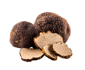 Whole black truffles and several thin slices showcasing the marbled interior of the gourmet fungus, a rare and expensive delicacy used in haute cuisine for its intense earthy aroma