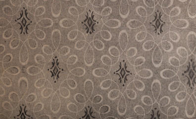 Old wallpaper on the wall. Old wallpaper for texture or background.