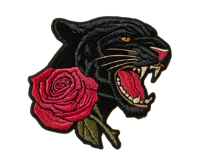 Embroidered black panther patch with a red rose featuring a roaring open mouth, sharp fangs, and detailed thread stitching in a classic tattoo art style