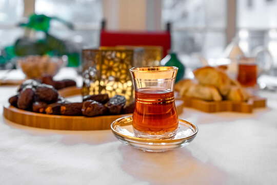 Ramadan food and snacks including spinach fatayer pastries, dates, dried fruits and tea.