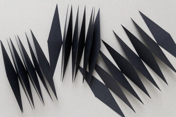 folded machine-cut repeating retro diamond shapes