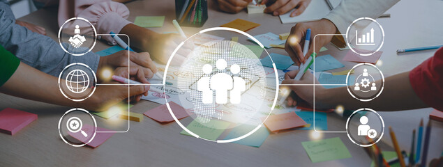 Business teamwork connected around a globe representing cooperation, leadership, and organizational...