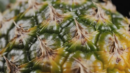 Closeup of a pineapple skin texture showing its unique pattern and vibrant colors. - Powered by Adobe
