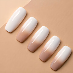 Glossy acrylic nails in monochrome gradient, laid out neatly.