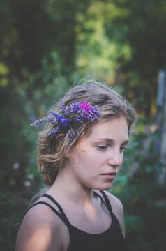 portrait of teenage girl with flowers in hair
