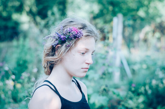 portrait of teenage girl with flowers in hair
