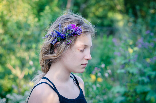 portrait of teenage girl with flowers in hair