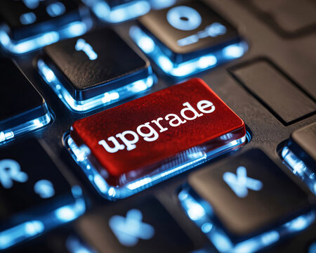 Red upgrade key on a blue backlit keyboard for tech concepts - Powered by Adobe