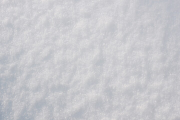 Obraz premium Soft white snow texture with subtle natural grain and delicate winter surface, minimal abstract background suitable for seasonal design, holiday themes, clean layouts and copy space