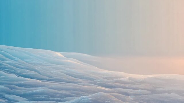 Close-up video of cracked ice surface reflecting soft pastel sunset hues, with a hazy blue sky, evoking a feeling of serene cold and abstract beauty.