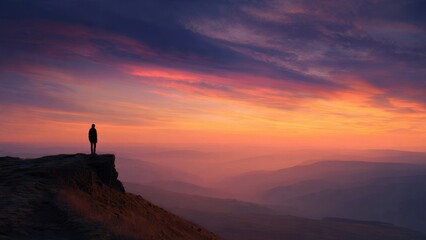 Fototapeta premium Silhouette on Mountain at Sunset