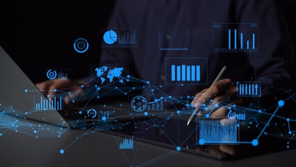 A business professional engaged in data analysis using a laptop. Interactive graphs and charts float around, illustrating the importance of data-driven decision-making and insights. Xenic