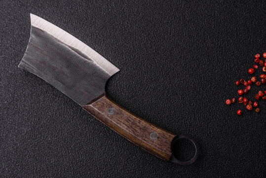 A kitchen cleaver or butcher's knife for cutting meat. A butcher's cleaver