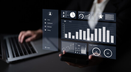 A business professional engages with digital data analytics on a laptop, highlighting performance metrics and insights essential for informed decision-making. Impute
