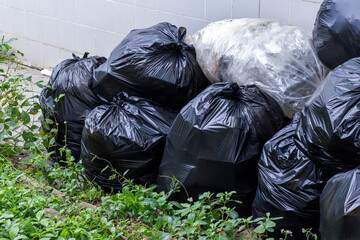 waste, pile of black garbage bags, plastic waste problem and environmental pollution, plastic waste, suitable for recycling and waste management concept
