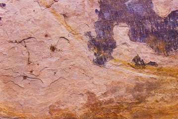 Fototapeta premium Earthy sandstone texture with rough surface cracks and abstract mineral patterns