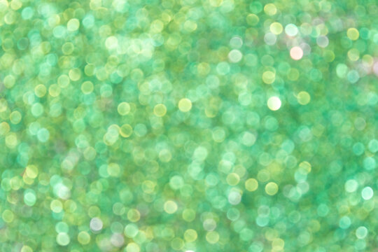 Abstract green bokeh background for Easter or springtime. Blurred focus and copy space