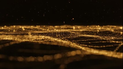 Golden particles and shimmering light trails flow across a dark void, forming glowing waves and bokeh effects. A luxurious, abstract motion background perfect for intros, titles, or luxury branding.