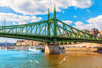View of Liberty Bridge over turquoise Danube River in Budapest, Hungary