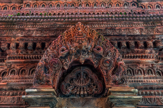 Fragment of the Mahabuddha temple facade with numerous Buddha statues. Patan (Lalitpur), Kathmandu, Nepal.