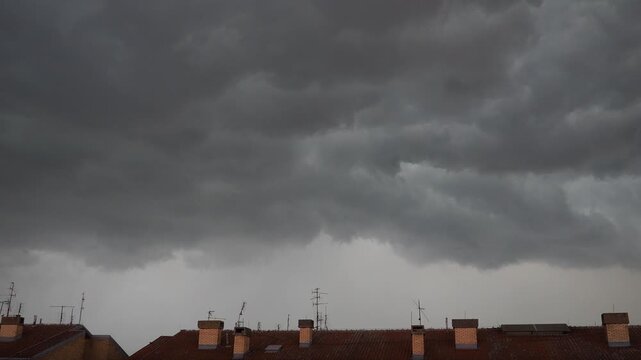 Dark Storm Clouds Raced Overhead, Swirling Ominously As They Cast Shadows Over The Tiled Roof Below. Air Crackled With Electricity, Wind Howled Fiercely, Creating A Sense Of Urgency And Foreboding