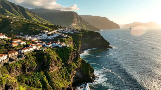 Scenic aerial view of a coastal village nestled on a lush green cliffside with ocean waves and clear sky