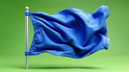 A blue flag is blowing in the wind. The flag is on a green background