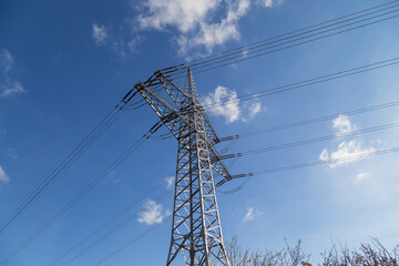 High-voltage pylon with cables for power supply.