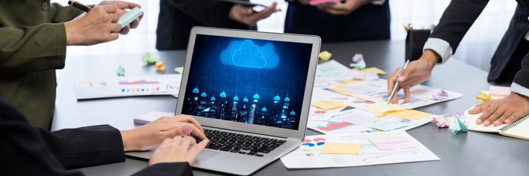 Analyst team use sticky note for creative and analytic brainstorm for business idea with BI data dashboard on laptop screen. Analysis financial data visualization tech for marketing strategy. Prodigy - Powered by Adobe