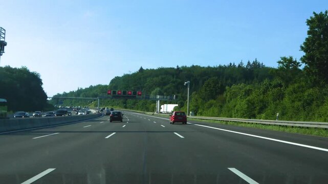 Street view of German autobahn or highway, freeway driving on the A8 in Baden-W&uuml;rttemberg to Stuttgart as time lapse 