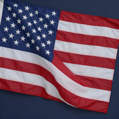 Fototapeta premium American flag on dark blue background with copy space for July 4 or Memorial Day patriotic message and presidential midterm elections