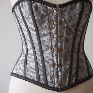 Illustration showcases vintage corset design with vertical stripes and structured shape, embodying fashionable elegance