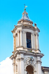Fototapeta premium Baroque bell tower from the Church of Sant Agnese in Agone. Architectural masterpiece is a significant landmark located in the Piazza Navona, Rome, Italy