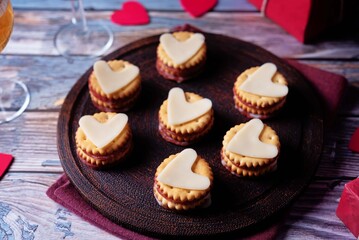 Salami sausage and cheese slices in the form of hearts and crackers for Valentine's day holidays