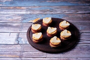 Salami sausage and cheese slices in the form of hearts and crackers for Valentine's day holidays