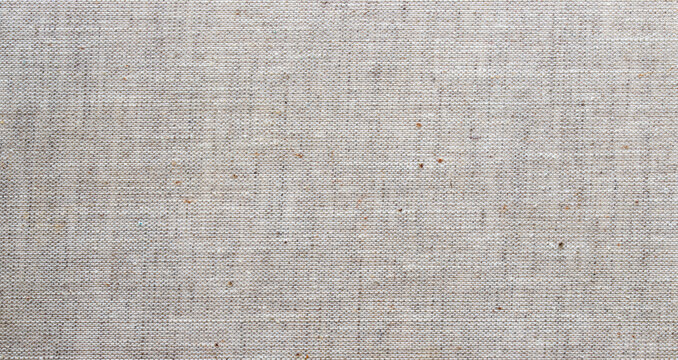 Light grey linen fabric texture with natural woven fiber patterns for clean minimalist background and textile design
