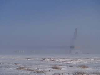 Grain elevator in fog