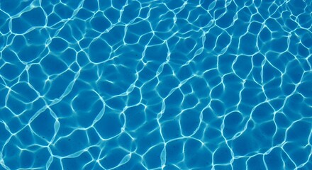Obraz premium Rippled water surface with sunlight reflections in a swimming pool